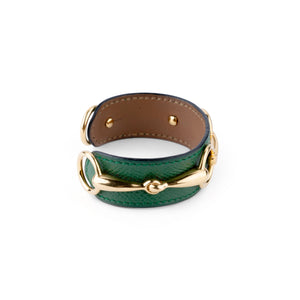 Bracelet de la maison Hermès en cuir et métal doré