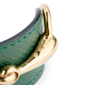 Bracelet de la maison Hermès en cuir et métal doré