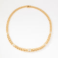Yellow gold curb chain necklace interspersed with diamond links