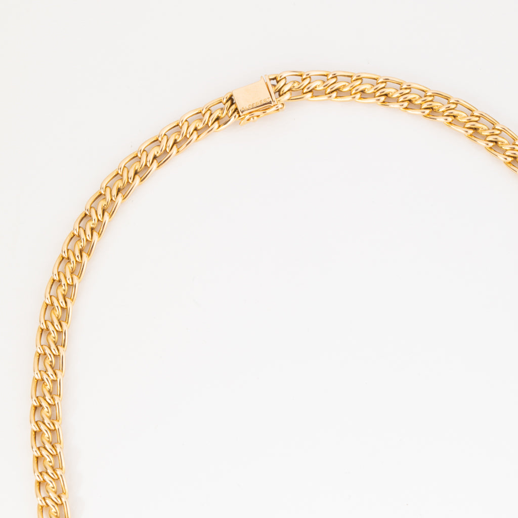 Collier or jaune maille gourmette intercalé de maillon en  diamant