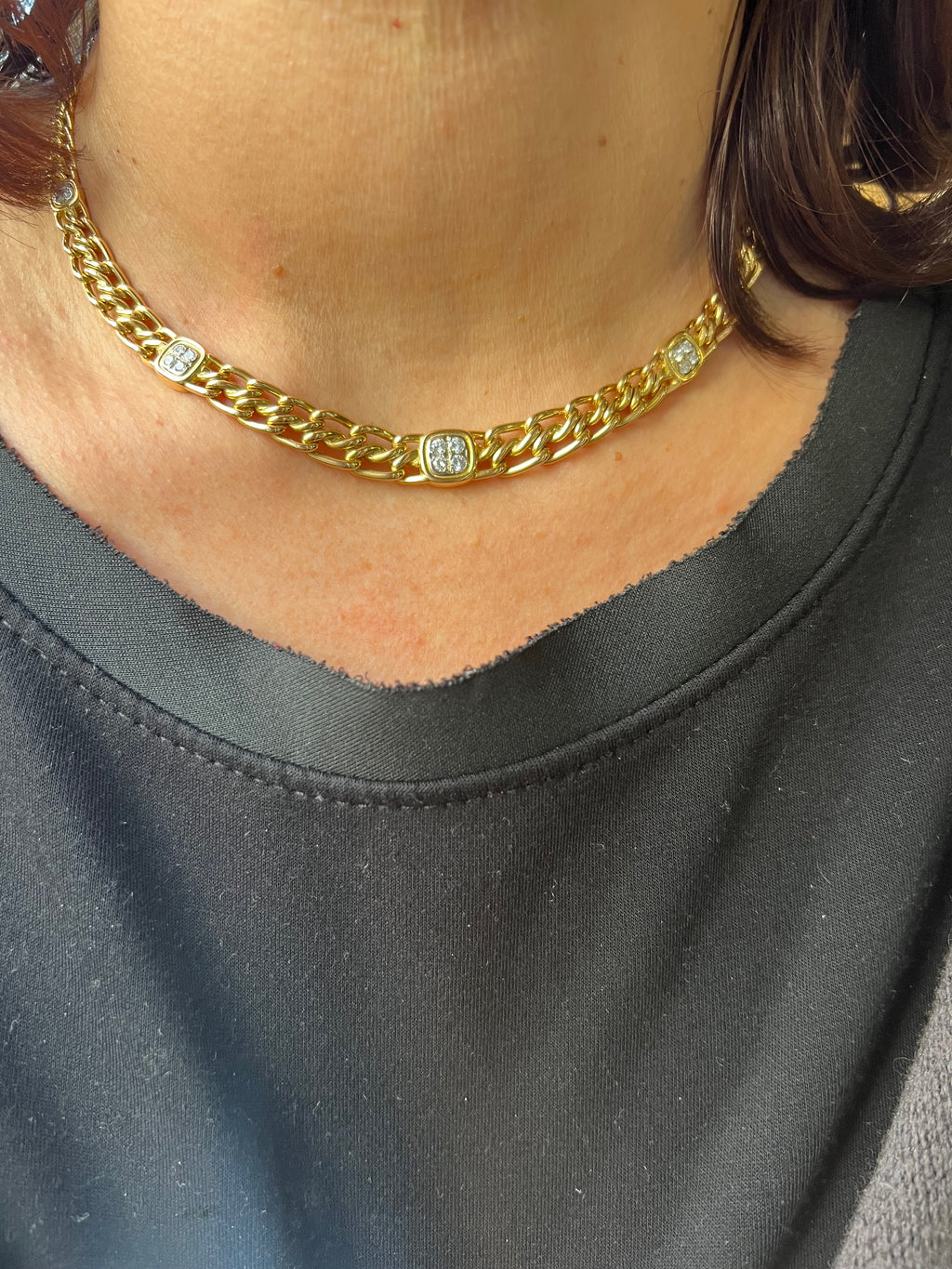 Yellow gold curb chain necklace interspersed with diamond links