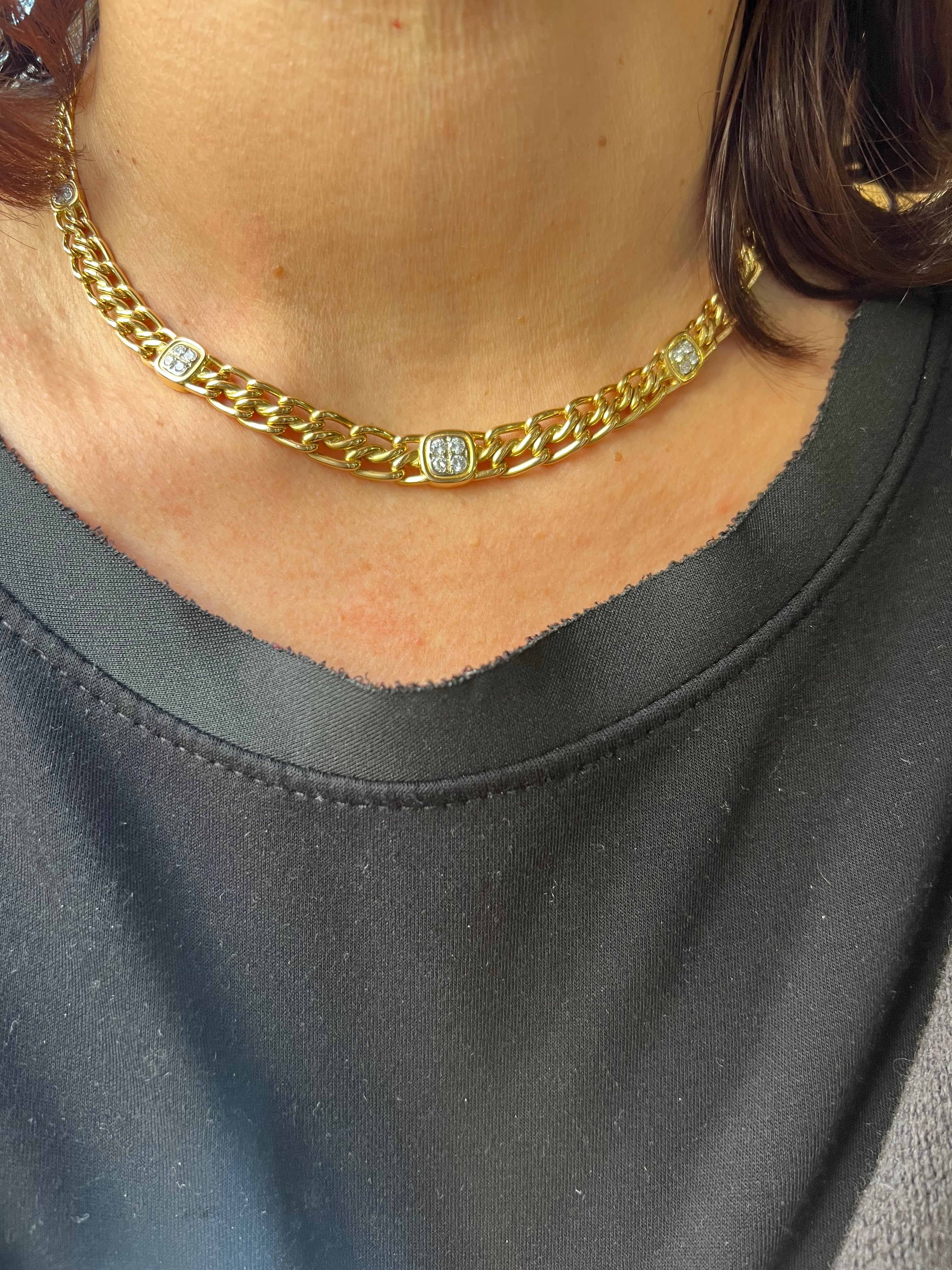 Yellow gold curb chain necklace interspersed with diamond links