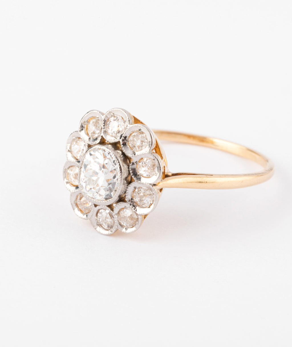 Bague marguerite ancienne en or et diamant