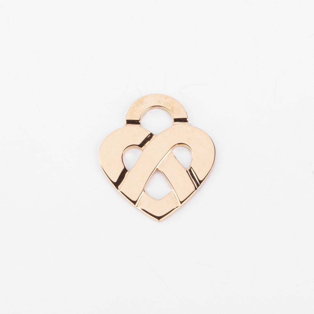Pendentif en or jaune formant un cœur de la maison Poiray