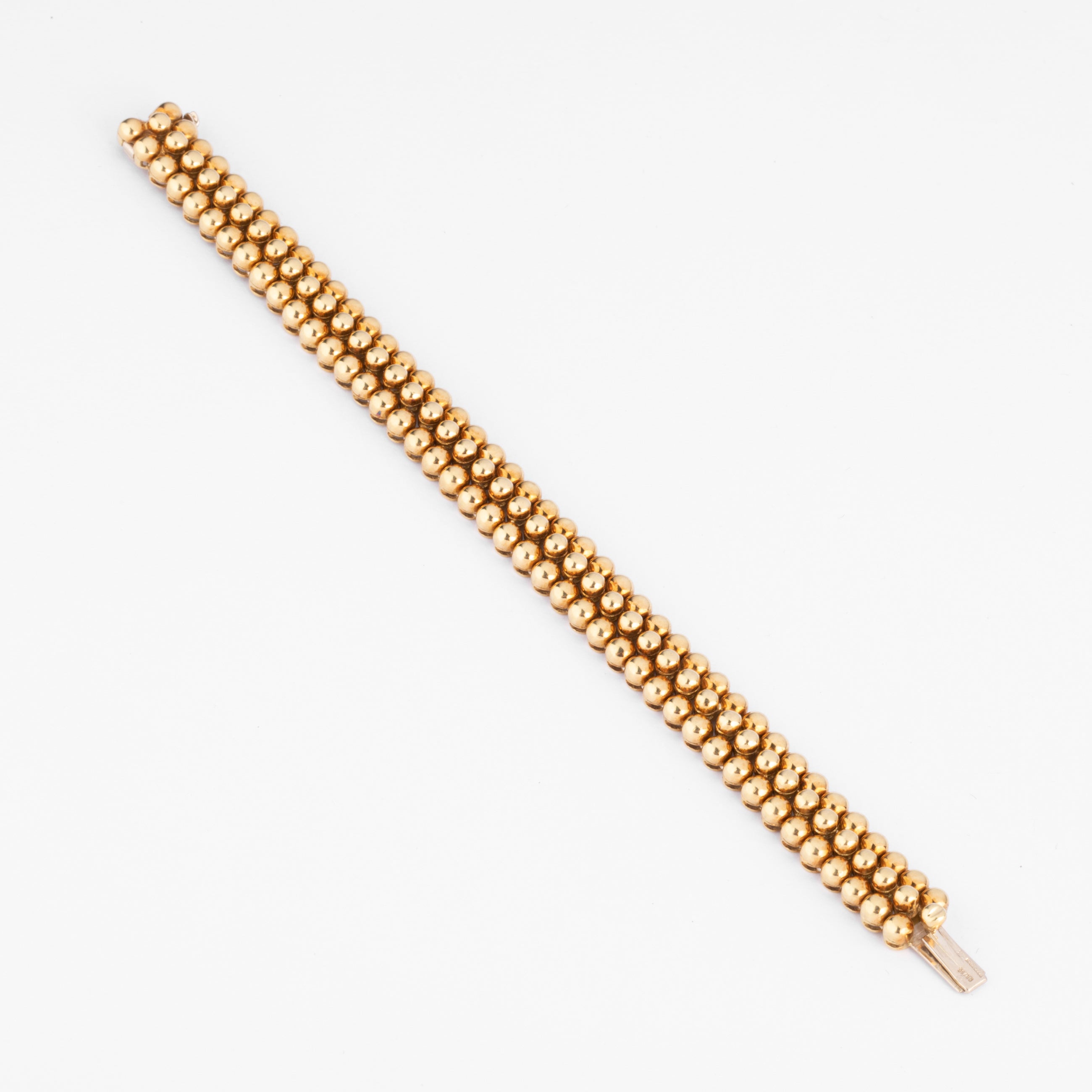 Bracelet or jaune 18k signé et numéroté de la maison Boucheron collection Grains de Raisin