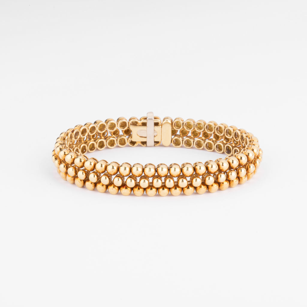 Bracelet or jaune 18k signé et numéroté de la maison Boucheron collection Grains de Raisin
