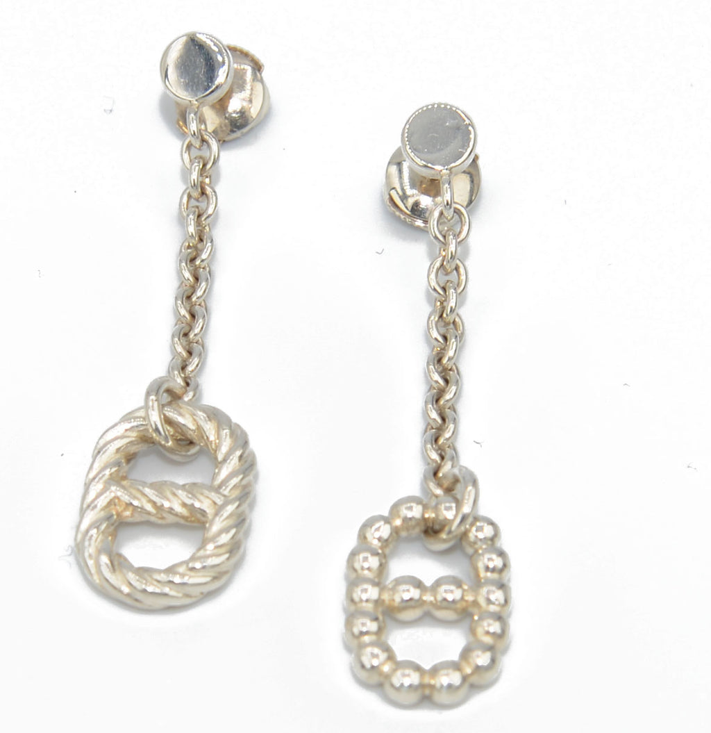 Paire de boucles d'oreilles signées Hermès en argent