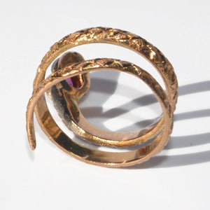 Bague serpent bi-colore ornée d'un rubis