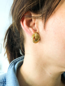 Boucles d'oreilles or jaune signée Hermès