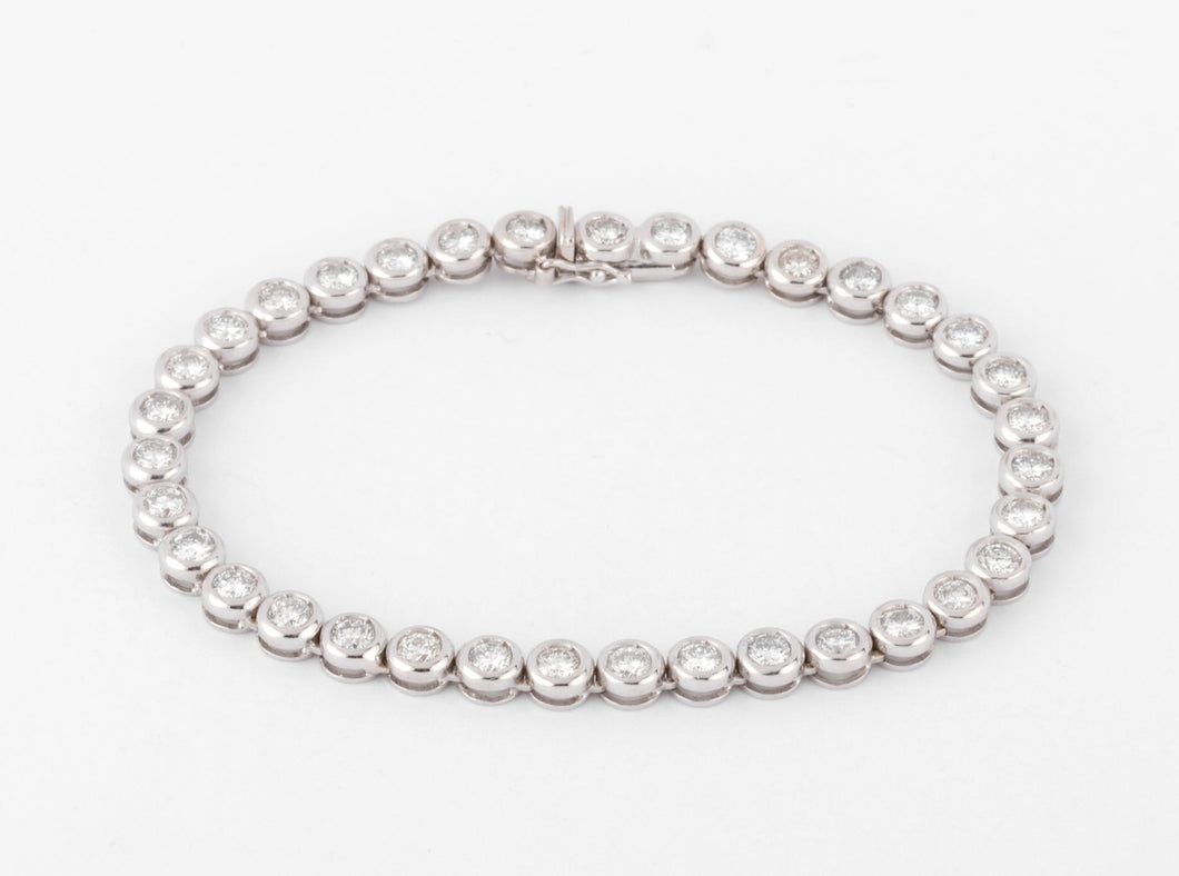 Bracelet en or gris et diamants tennis serti tennis