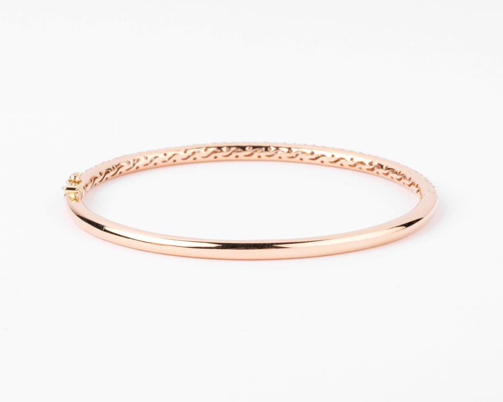 bracelet jonc ouvrant en or rose serti de 3 lignes de diamant