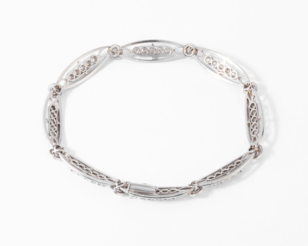 Bracelet or platine et et diamant formant des maillons ovales